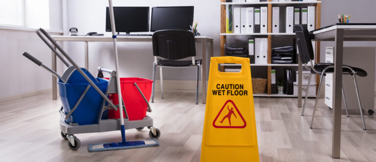 Wet Floor Caution Sign And Cleaning Equipments On Floor